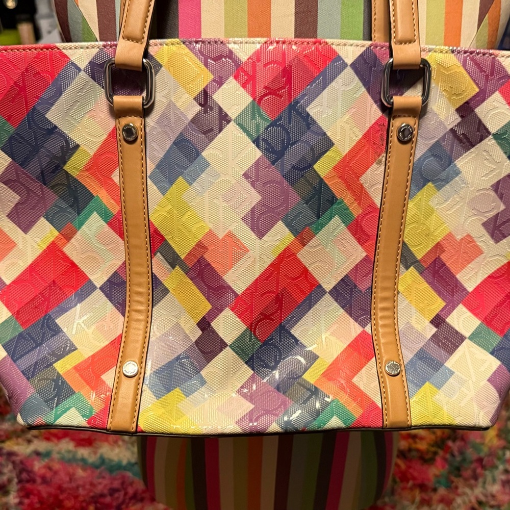 Beautiful multicolored tote. Can fit books, lap top or what ever you need!